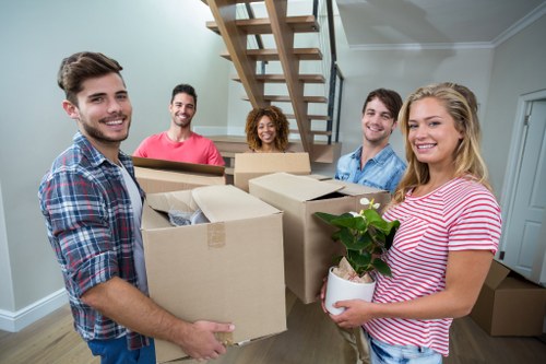 Removal team planning a move in a Canary Wharf apartment building