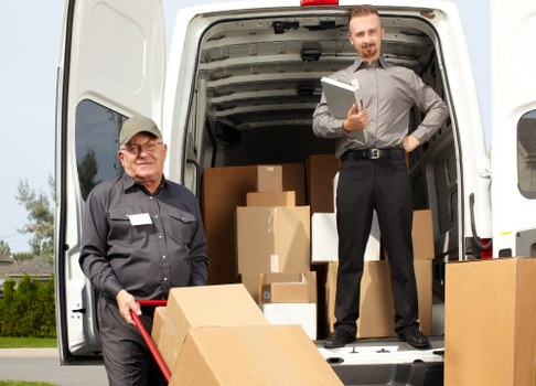 Man and van moving service in Canary Wharf with boxes and furniture