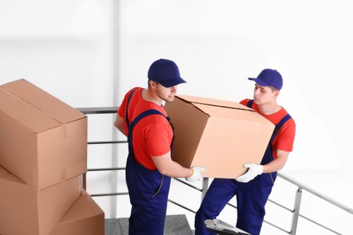 Removal team planning a move in a Canary Wharf apartment building