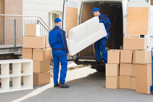 Man and van service operating in Canary Wharf near modern residential towers