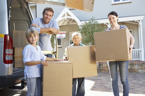 Professional unpacking service organising boxes in a modern Canary Wharf home